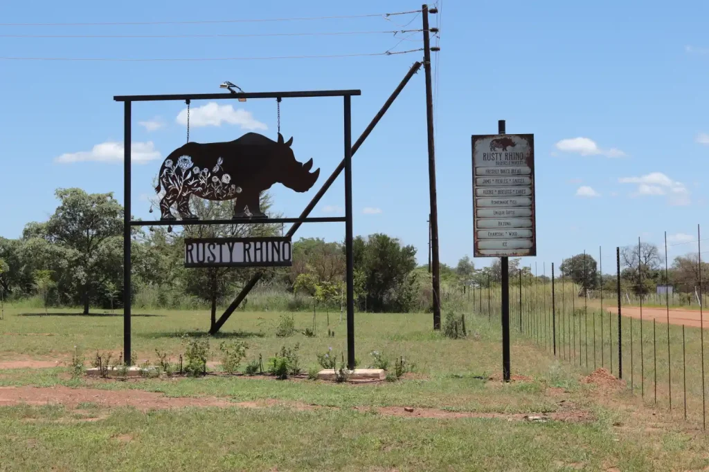 Rusty Rhino bushveld shop in Dinokeng South Africa market souvenirs coffee food gifts secure fence area